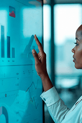 Woman analyzing data on screen